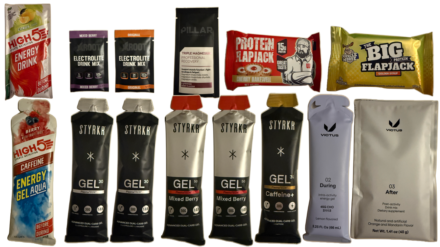 premium gel box with running gels, and high protein snacks, muscle moose, uncle jack flapjack, Victus 02,victus 03, styrkr, pillar,High 5, active root electrolytes, High 5 caffeine gels and high 5 energy, products all spread out